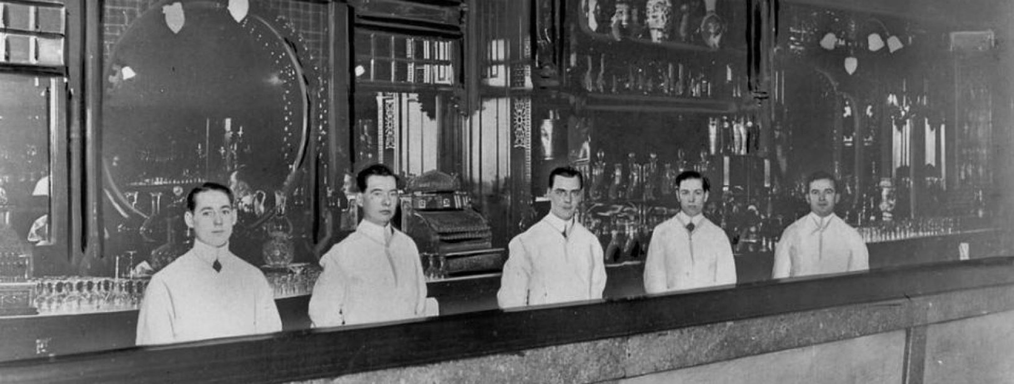 five_bartenders_behind_st